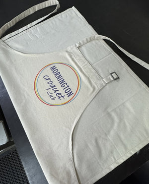 Organic cotton custom apron with Mornington Croquet Club logo printed on the front pocket, featuring an adjustable neck strap.