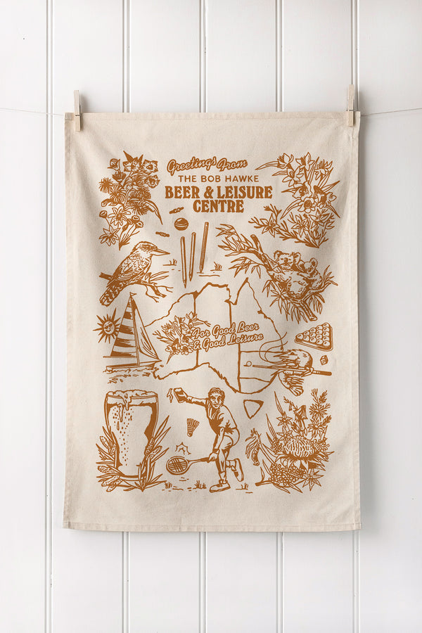 Custom screen printed natural cotton tea towel with earthy botanical artwork in portrait layout – ideal for merchandise or gifts.