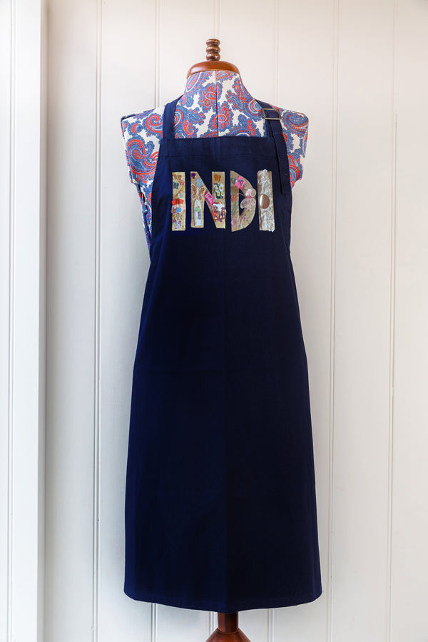 Navy apron with white text and colour graphic digitally printed