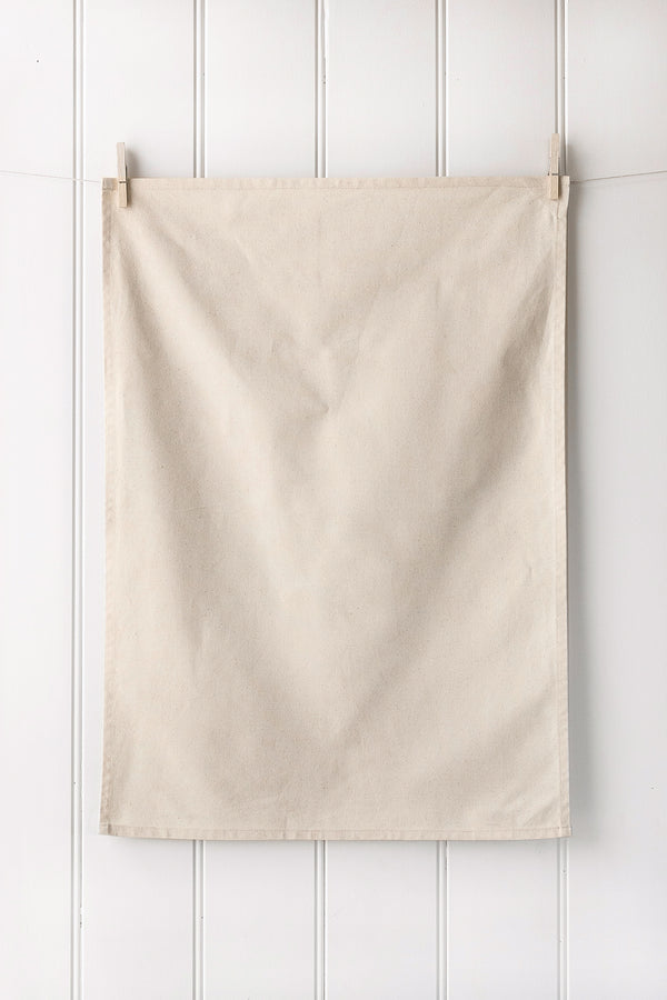 Unprinted natural organic cotton tea towel in portrait orientation – premium quality fabric for custom screen printing.