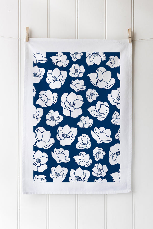 Custom screen printed tea towel in white cotton with intricate blue floral pattern – ethically made, vibrant design.