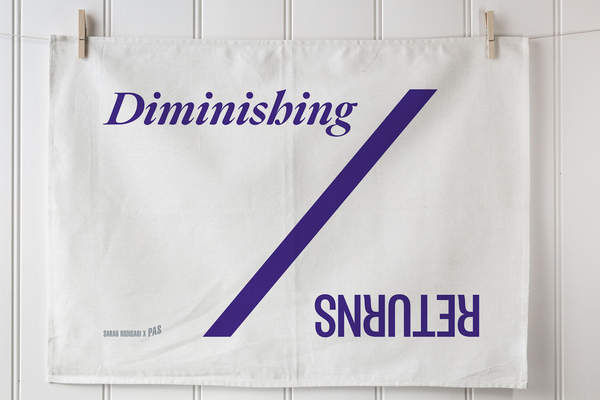 Custom printed tea towel with purple diagonal design and branding on white cotton