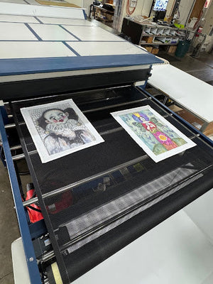 Custom digital printing of artist-designed tea towels in progress at Expressions Tea Towels' Australian print studio, showing vivid artwork on linen blend fabric.
