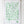 White cotton tea towel with green vegetable illustrations hanging on a wooden rack.