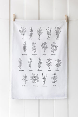 White cotton tea towel with herb design in black