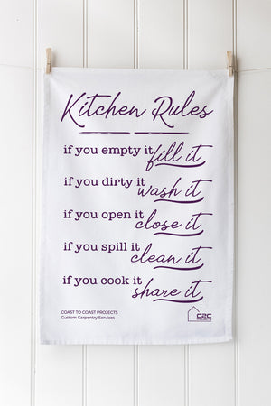 Kitchen-themed tea towel with humorous text on a white background
